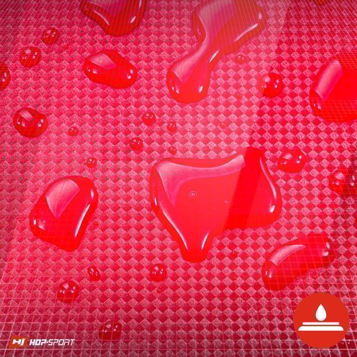 Acercamiento a la cubierta impermeable del colchón de gimnasia Hop-Sport en color rojo